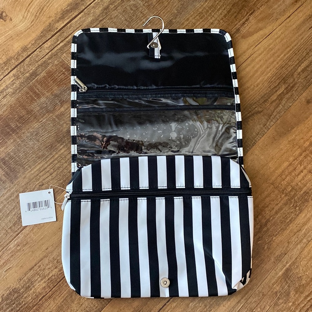 Macy’s black & white polka dot hanging cosmetic accessories bag.